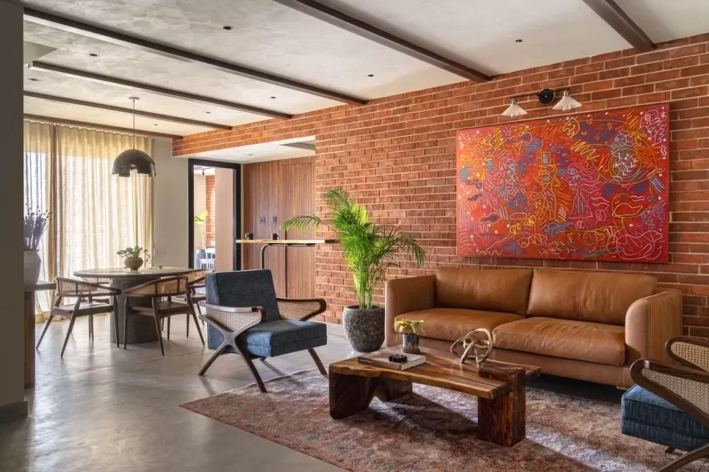 Industrial interior design style living room with exposed brick and concrete floor