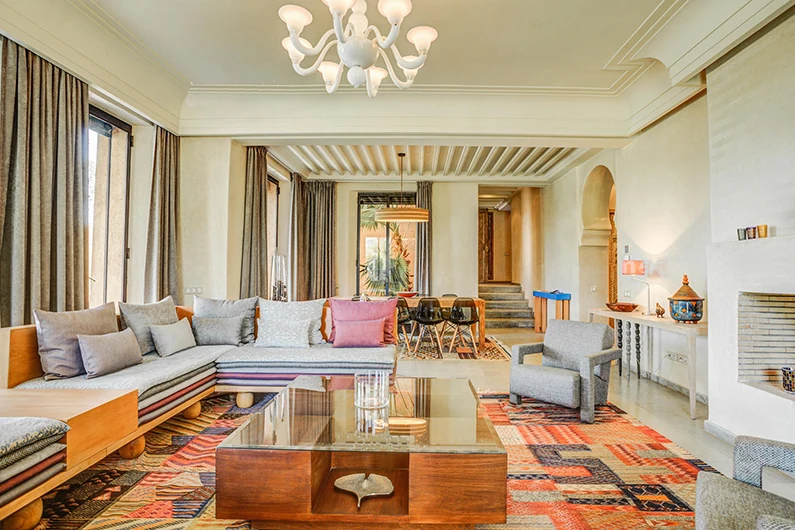 Moroccan interior design style majlis with carved plaster and patterned rugs